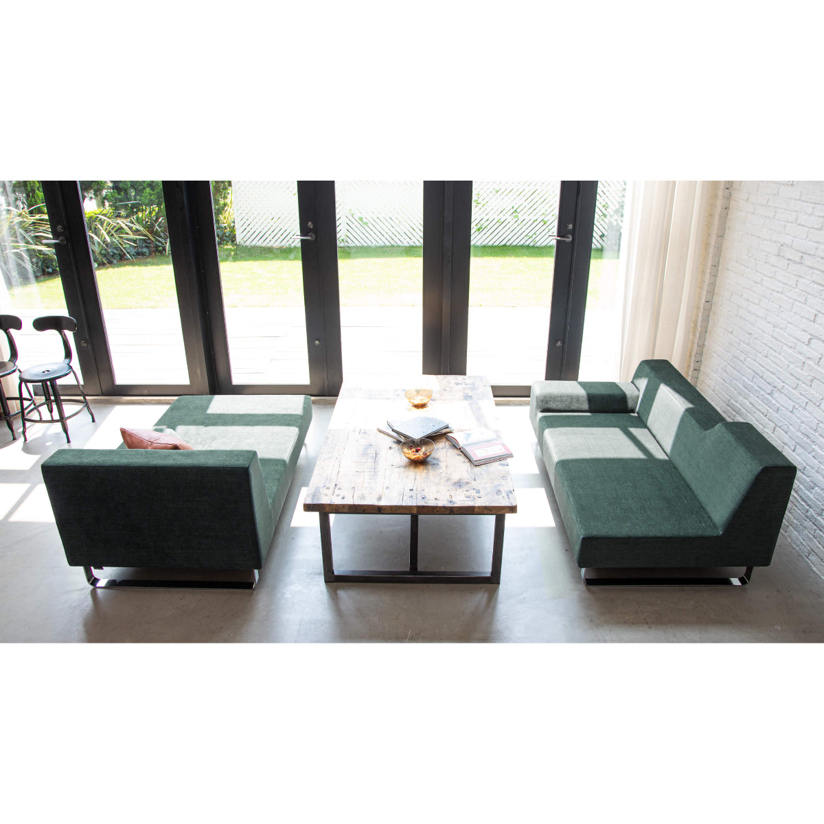 The clean seating surface, with no separate cushions for the back or seat, is designed to make daily maintenance easy.